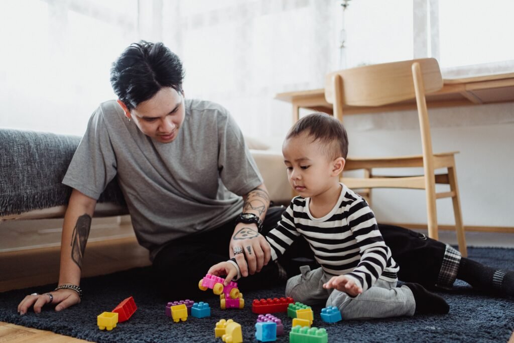 Parent engaging in conversation with toddler during playtime to support speech development