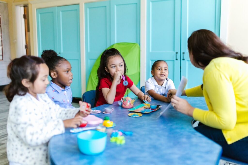 Speech therapist working with toddler using play-based therapy techniques to build communication skills